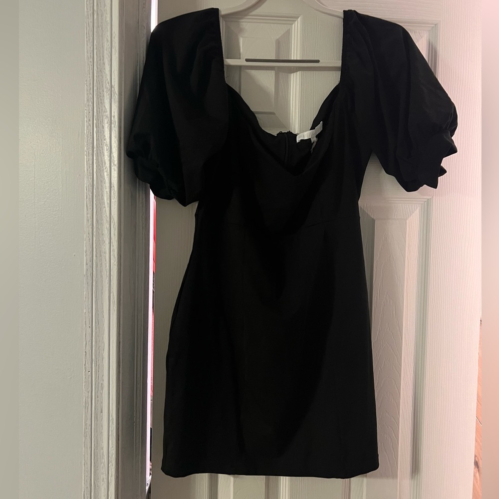 Form-fitting black mini dress